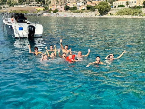 Private boat tour swimming in crystal clear waters